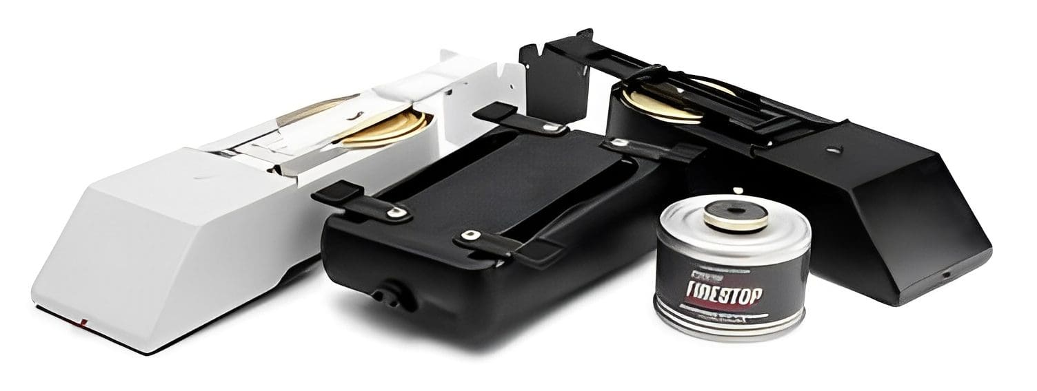 A portable black camping stove with a fuel canister attached.