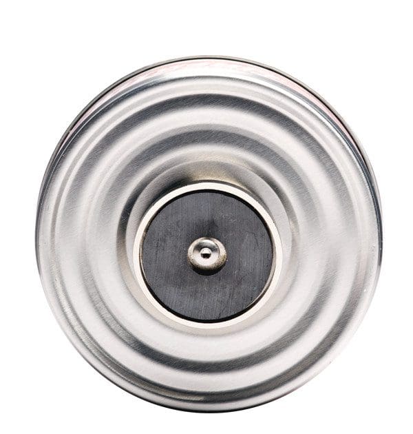 A close-up of a metallic, circular object with concentric ridges.