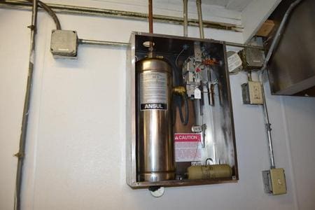 A fire suppression system installed on a wall inside a building.
